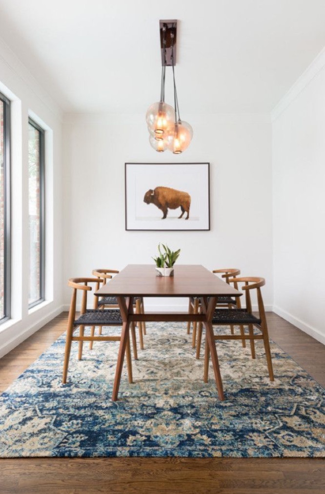 Adding oversized rug to dining space a floor rug makes a dining area cozy in winter