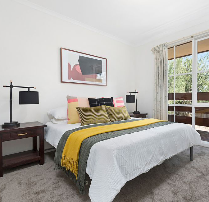 A styled bedroom with mustard accents Property Styling Melbourne - Leeder Interiors